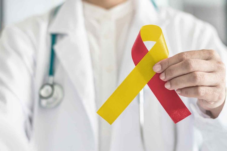 Healthcare professional holding a ribbon for Hepatitis C